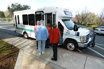 Bus and awaiting passengers.