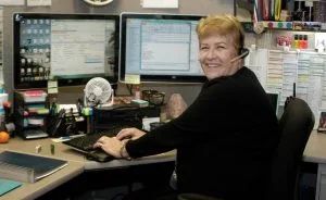 Woman at desk smiling