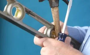Hammer, level and screwdriver.